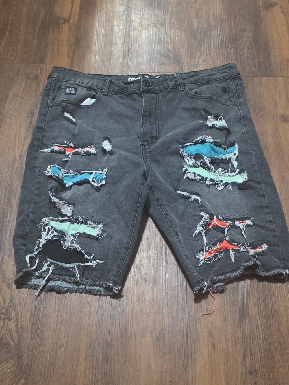 Men's Black Distressed Jean Shorts with Multicolor Patch Accents